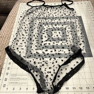 Sheer bodysuit with black stars. Unbranded. Sold as one size fits all.